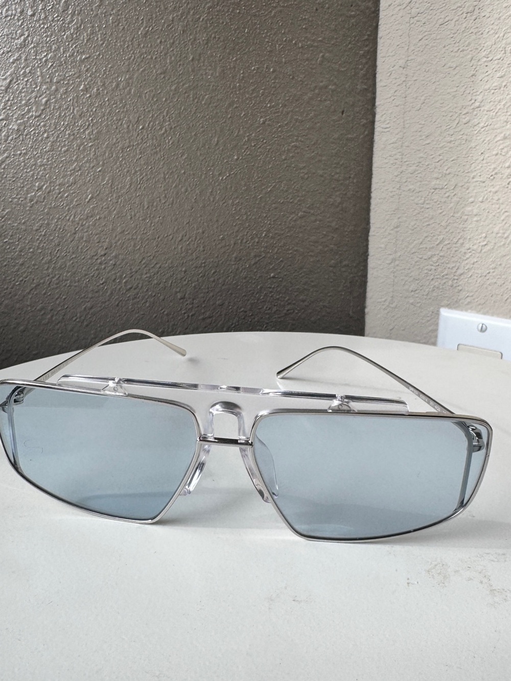 Prada Silver Frame Sunglasses with Light Blue Lenses unisex